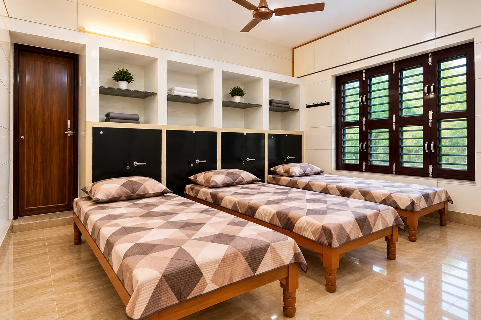 A triple-sharing room with three single beds in a row, lockers along the wall and a tall window